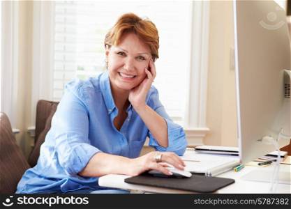 Portrait Of Senior Woman Using Computer At Home