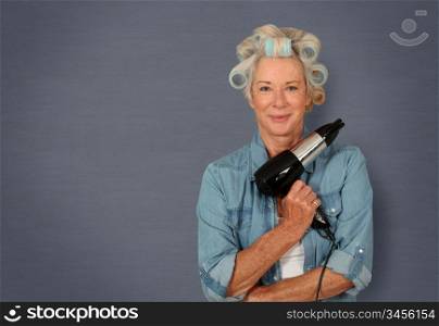 Portrait of senior woman with hair-curlers