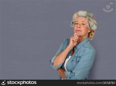 Portrait of senior woman with hair curlers