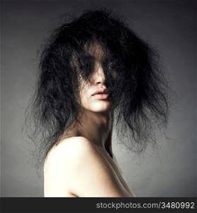 Portrait of sensual lady with magnificent bushy hair