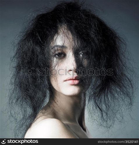 Portrait of sensual lady with magnificent bushy hair