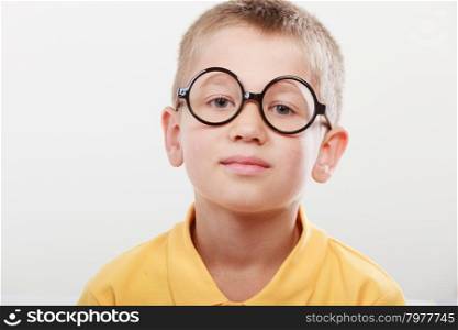 Portrait of serious kid little boy in glasses.. Portrait close up of cute serious kid little boy nerd in glasses.