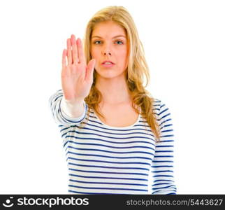 Portrait of serious teen girl showing stop gesture&#xA;