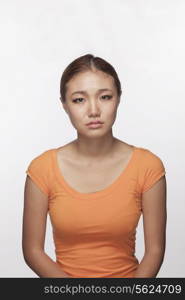 Portrait of serious teenage girl, studio shot