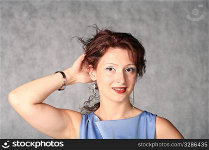 portrait of sexy redhead girl on grey background