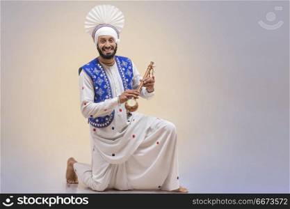 Portrait Of Sikh Man Doing Bhangra Dance