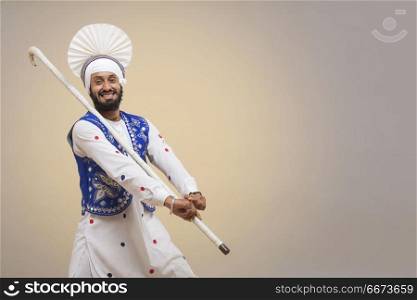 Portrait Of Sikh Man Doing Bhangra Dance