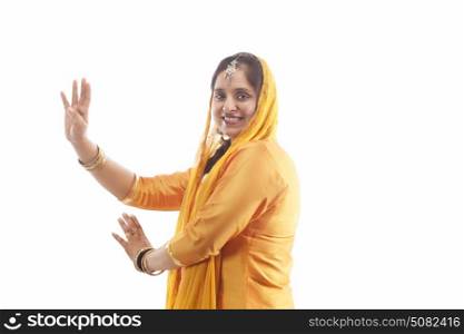 Portrait of Sikh woman doing bhangra dance