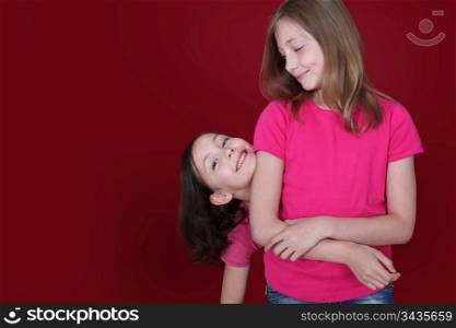 Portrait of sisters showing complicity
