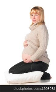 portrait of sitting pregnant woman isolated on white background
