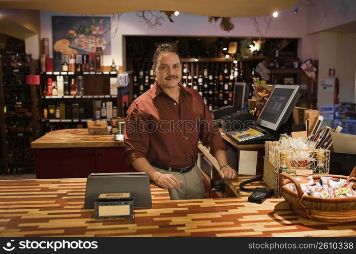 Portrait of small business owner in gourmet market