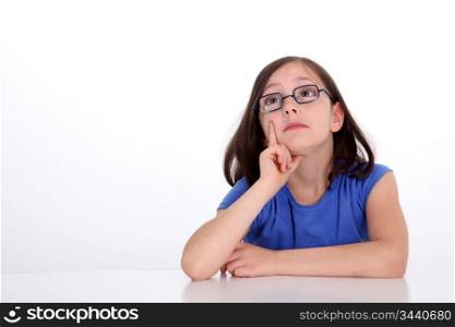 Portrait of smart little girl on white background