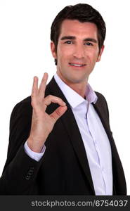 portrait of smart man making okay sign