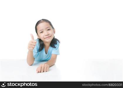 Portrait of smile Asian little girl showing thumb up with copy space isolated on white background with clipping path