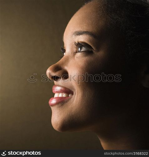 Portrait of smiling African-American young adult female.