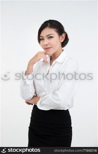 Portrait of smiling and happy asian businesswoman standing with arms folded and looking at camera dress in black suit isolated on white background
