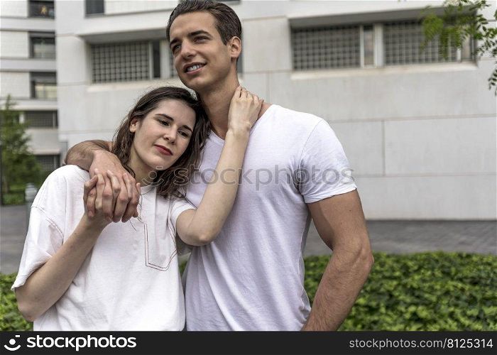 Portrait of smiling beautiful woman and her handsome boyfriend in casual summer clothes. Happy cheerful family. Female having fun.