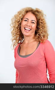 Portrait of smiling beautiful woman with curly hair