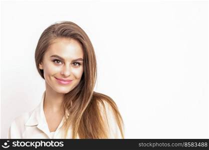 Portrait of smiling beautiful woman with dark hair, dressed in a white shirt, looking at camera isolated against the white background with copy space. Portrait of smiling beautiful woman