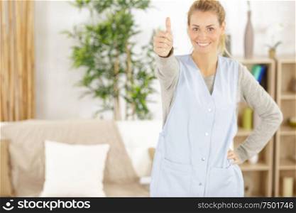 portrait of smiling beautiful young housekeeper