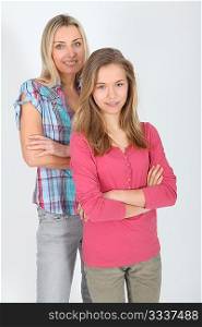 Portrait of smiling blond mother and daughter