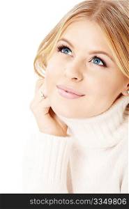 Portrait of smiling blonde in the white sweater, isolated