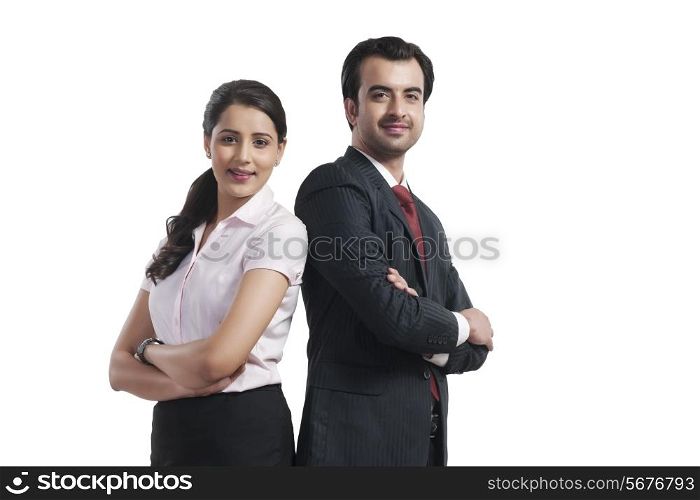 Portrait of smiling business colleagues standing arms crossed over white background
