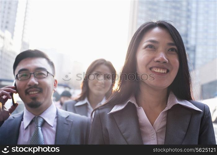 Portrait of smiling business people outdoors, Beijing