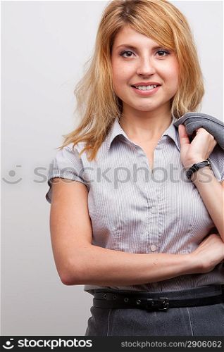 Portrait of smiling business woman, isolated on grey background. Female model