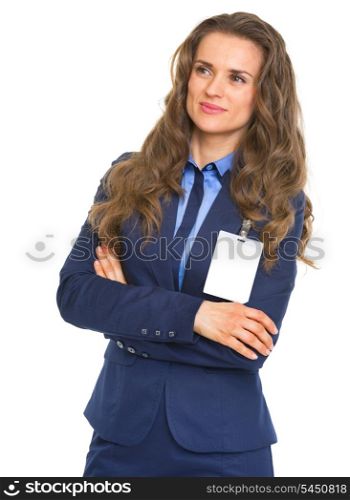 Portrait of smiling business woman with badge looking on copy space