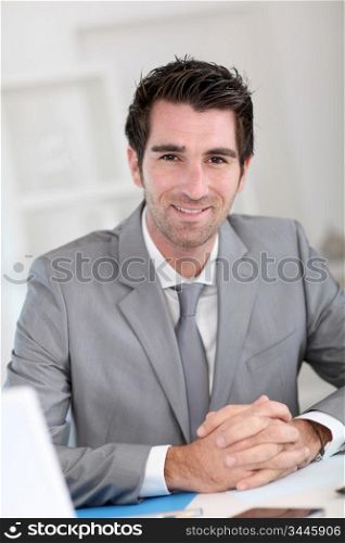 Portrait of smiling businessman at work