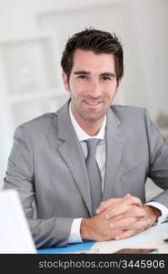 Portrait of smiling businessman at work