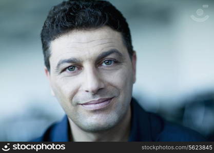 Portrait of smiling businessman, close-up