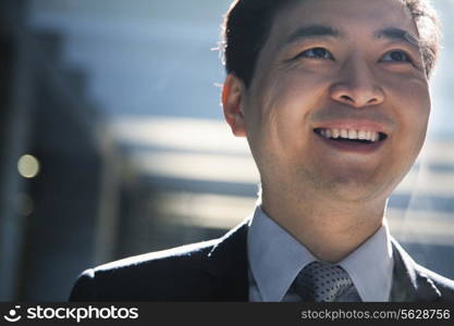 Portrait of smiling businessman in a parking garage