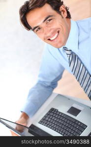 Portrait of smiling businessman in office