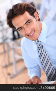 Portrait of smiling businessman in office