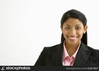 Portrait of smiling businesswoman against white background.