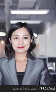 Portrait of smiling businesswoman in Beijing