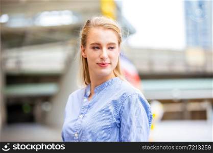 Portrait Of smiling Businesswoman Standing Outdoors