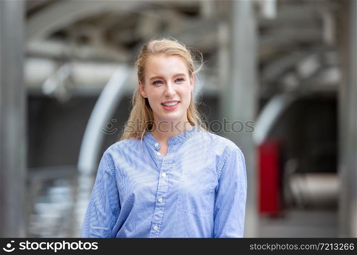 Portrait Of smiling Businesswoman Standing Outdoors