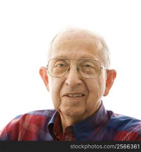 Portrait of smiling Caucasion elderly man in a plaid shirt and glasses.