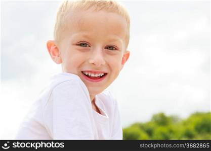 Portrait of smiling child kid outdoor. Happy childhood.. Happy smiling child kid outdoor.