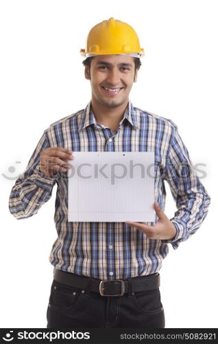 Portrait of smiling contractor holding placard