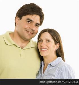 Portrait of smiling couple against white background.