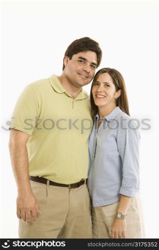 Portrait of smiling couple standing against white background.