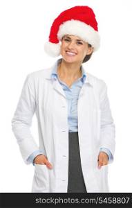 Portrait of smiling doctor woman in santa hat