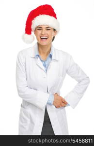 Portrait of smiling doctor woman in santa hat