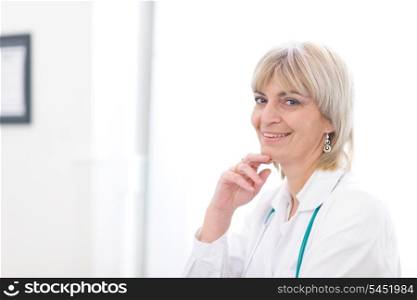 Portrait of smiling elderly doctor