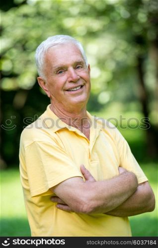 Portrait of smiling elderly man outdoor in park