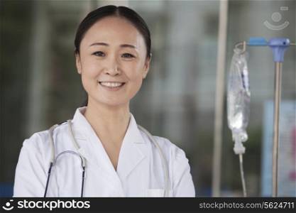 Portrait of smiling female doctor outside of the hospital